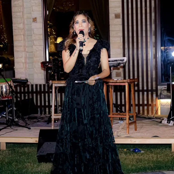 Pooja Sudha portrait in a black feather gown