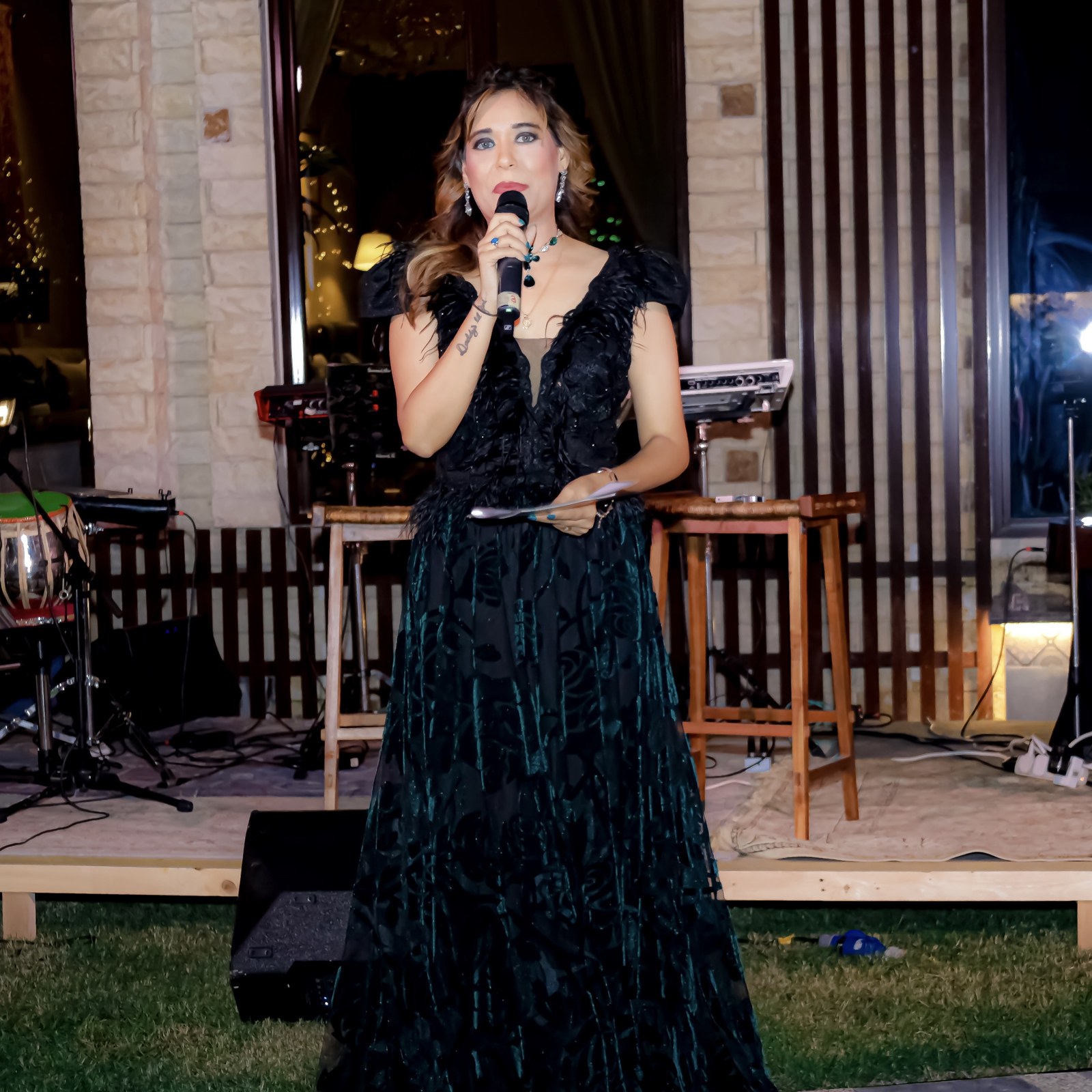 Pooja Sudha portrait in a black feather gown