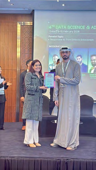 Pooja Sudha receiving recognition at a Data Science and AI summit