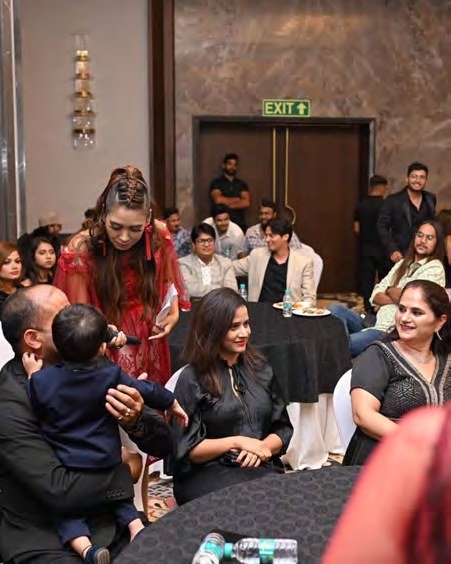 Pooja Sudha with guests at an evening gala in Dubai