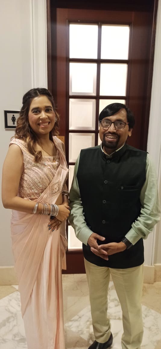 Pooja Sudha at a formal event in a pink saree