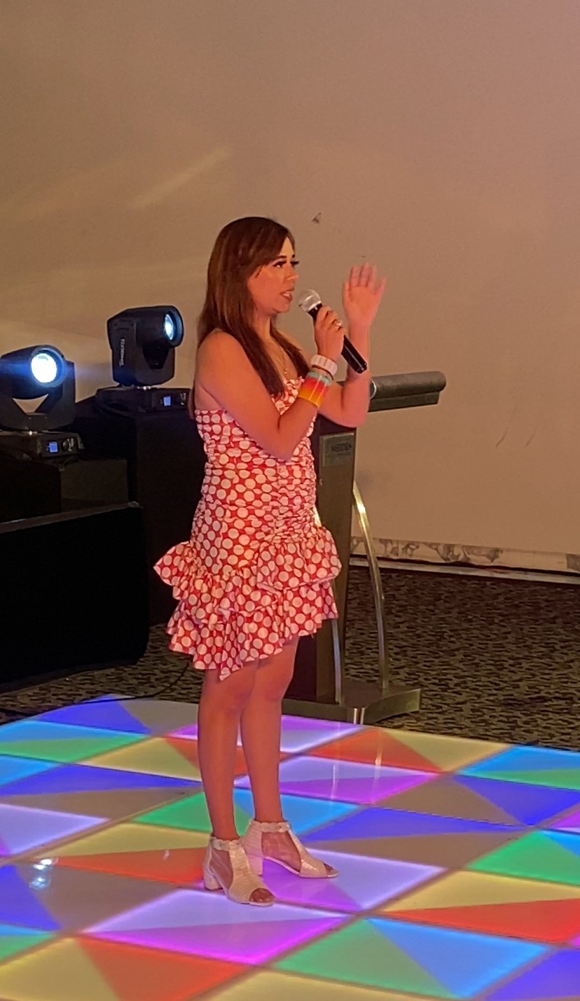 Pooja Sudha dancing at a sangeet night in a polka dot outfit